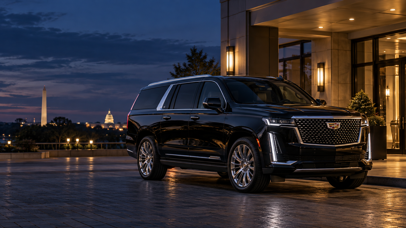 Illustrative black Cadillac Escalade ESV outside a hotel